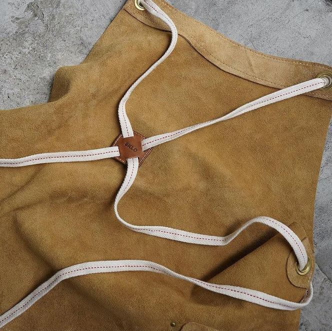 SKLO 一枚革の良さ、強さも生かす焚火エプロン（肩紐：綿）　Mustard Yellow（マスタードイエロー） 141305_EL17VC02